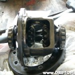With the pinion shaft removed, rotate the gears and the pinion shaft gears will fall out of the housing leaving the two side gears inplace.
