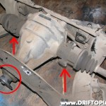 Disconnect the driveshaft from the companion flange (Circled) and then disconnect the output shafts from the differntial.