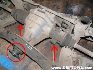 Disconnect the driveshaft from the companion flange (Circled) and then disconnect the output shafts from the differntial.