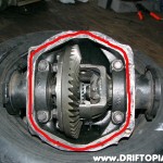Place a bead rtv silicone around the rear of the housing and then reinstall the rear cover.