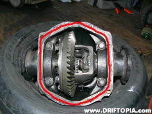 Place a bead rtv silicone around the rear of the housing and then reinstall the rear cover.