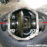 Tap the ouput shaft flanges out of the housing.