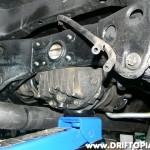 Place a jack under the differential taking care not to raise the rear end.