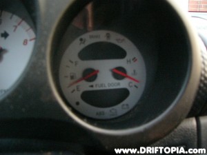 Reassemble the cluster in the reverse order of removal.  Note that you cannot see the black tape that blocks the P/S warning light from illuminating.