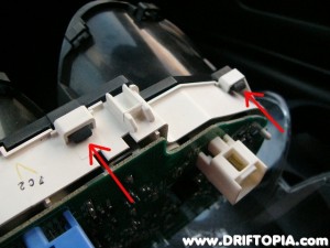 Repeat the previous process on the black tabs to remove the solid trim from the cluster face.