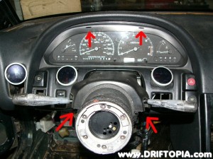 Remove the trim from the steering column and the cluster.