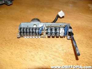 The odometer removed from the cluster.