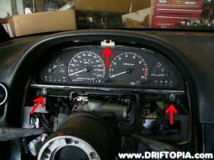 Disconnect the gauge cluster at the three highlighted points.