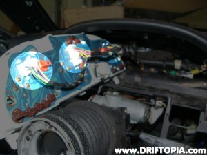 Disconnect the electrical harness from the cluster.