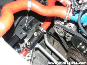 The oil cooler installs inline with the radiator hose.