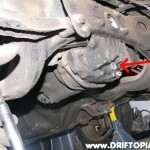 With the car on jackstands, drain the oul from the differential by removing the drain plug.