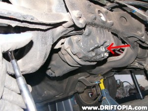 With the car on jackstands, drain the oul from the differential by removing the drain plug.