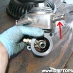 Since I run a SR20DET flywheel with 200sx starter, I had a few clearance issues with the water lines so I shortened the indicated nipple and then rotated the top of the housing to allow more clearance.