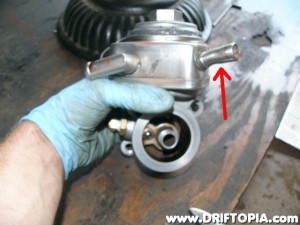 Since I run a SR20DET flywheel with 200sx starter, I had a few clearance issues with the water lines so I shortened the indicated nipple and then rotated the top of the housing to allow more clearance.