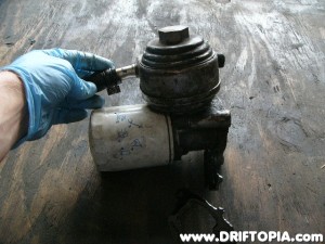 The oil cooler is built into the filter mount housing.  Coolant flows through the top via the two ports.