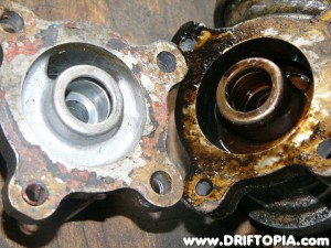 The CA18DET oil filter mount (clean) shares the same bolt pattern as the inline cooler mount pulled from salvage. (dirty)