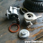 After removing the filter stud the cooler housing separates from the filter mount.  Once again, clean these parts thoroughly inside and out.  You don't want any of the old oil / sludge from the donor car to end up in your motor.