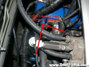 Use the small nipple to route a vacuum line for the fuel pressure regulator.