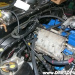 Re-wrap the bundle using electrical tape and then install the harness.  You can secure the harness with zip ties to the top of the fuel rail.
