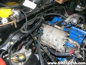 Re-wrap the bundle using electrical tape and then install the harness.  You can secure the harness with zip ties to the top of the fuel rail.
