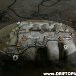 ca18detottpulsarmanifold216 Now disassemble the entire upper intake manifold. Make sure to remove the EGR plate from the back of the manifold.