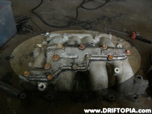 Now disassemble the entire upper intake manifold.  Make sure to remove the EGR plate from the back of the manifold.