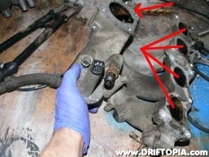 Clean, clean, clean.  The Gumout is your firend here.  Spray the crap out of the manifold in a well ventilated area and scrub the insides with the wire brushes.  Or you could sandblast it for quicker results.
