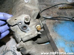 After removal, plug the valve cover vent (PCV) with a 1/4" brass plug from the hardware store. (Note: I run my valve cover vents to an oil catch can.  If you don't do this, you will want to keep this connection and just use a short piece of heater hose from the manifold to the valve cover.)