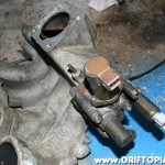 ca18detottpulsarmanifold228 Flip the manifold over once again and install the AAC and IAA from the CA18DET manifold to the new manifold. It will bolt up perfectly. (You can freshen up the gaskets with copper spray or a VERY thin coat of RTV)