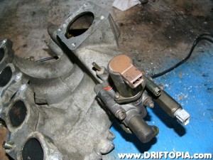 Flip the manifold over once again and install the AAC and IAA from the CA18DET manifold to the new manifold.  It will bolt up perfectly.  (You can freshen up the gaskets with copper spray or a VERY thin coat of RTV)