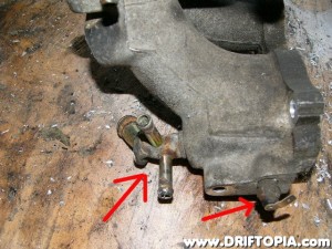 Since we kept the CA18DET lower manifold, you can go ahead and remove the water lines as well as the sensor from the new upper manifold.