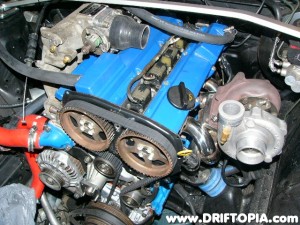 The manifold and turbo is now installed.  Check back for part 3 when I install the custom charge pipe and hook up all the plumbing.