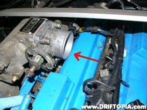 Temporarily fit the throttle body and then test fit the manifold.  Note that the KA24DE throttle body slightly contacts the valve cover.