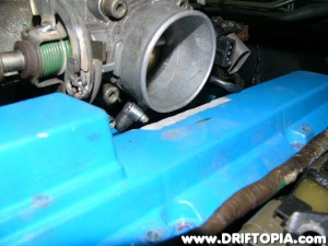 Test fit the manifold and valve cover to make sure you have removed enough material.  Then remove the cover 1 more time for additional modification.