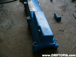 Once cut, use a flat head screwdriver and fold the edges of what is left of the nipple inward.  Then tap the piece into the valve cover using a hammer and extension.
