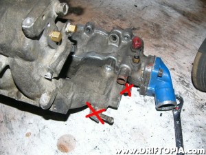 These coolant passages and coolant sensor are not necessary if you retain the CA18DET lower manifold.