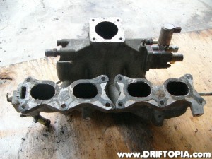 The CA18DET AAC and FICD transferred to the Pulsar manifold.  Gotta love Nissan parts interchangeability.
