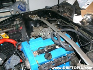 This is the test install.  I went ahead and installed the ka24de throttle body and it slightly rubs the valve cover.  The valve cover will need to be modified before the final install.