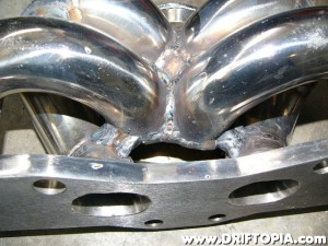 The collector is braced to the base of runners 2 and 3.  All welds were made with a mig welder using steel wire.  This works fine on stainless steel but does result in a little bit of spatter and an uglier weld.