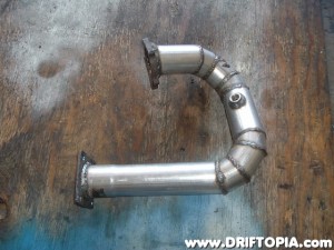 The new down pipe that will route the exhaust out the passenger front side of the 240.