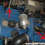 The factory valve cover vents were removed and replaced with 3/8" brake line adapters.  The brake lines are then used to replace the factory rubber lines to the oil catch can.
