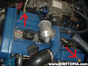 The factory valve cover vents were removed and replaced with 3/8" brake line adapters.  The brake lines are then used to replace the factory rubber lines to the oil catch can.