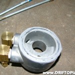 A thin bead of RTV was placed around the edge of the sandwich adapter before connecting it to the filter mount.