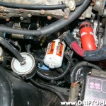 Reinstall the unit into the block.  Note the brass fittings to the left of the oil filter.