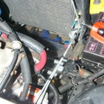 Make the appropriate bends and connect the first line to the radiator.  Tighten the connections down and then repeat for the second line.  The end result will look like this.
