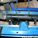 psremovalpart4c Disconnect the lower left power steering line from the rack and then drain the fluid into an oil pan.