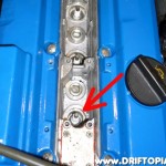With the coolpack removed, locate and remove the spark plug over cylinder #1. (arrow)