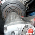 ca18dettimingbeltf Remove the crank pulley bolt using an impact gun and a 27mm socket.