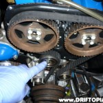 ca18dettimingbeltj Loosen the tensioner with a 13mm wrench.