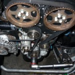 Rotate the engine using the 27 mm socket and wrench.  Check for any belt slippage or deflection.  Note the llen wrench still on the tensioner.  This way you can vary the tension during rotations.